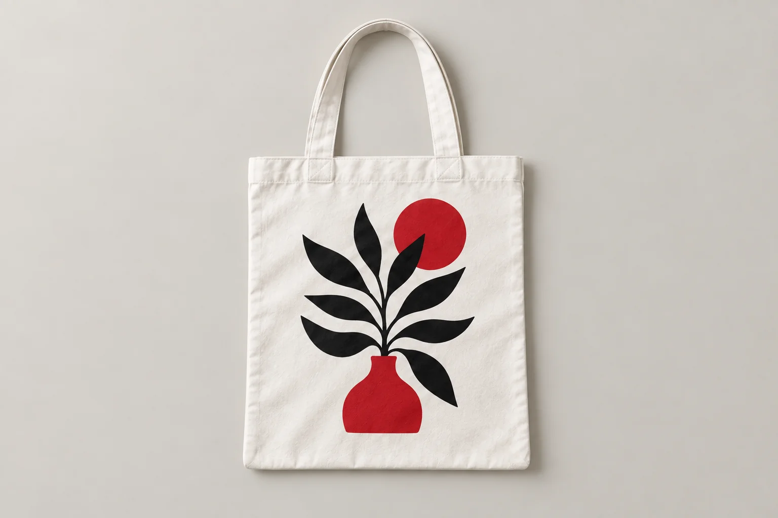 Illustrative mockup of a white tote bag with a black and red botanical print