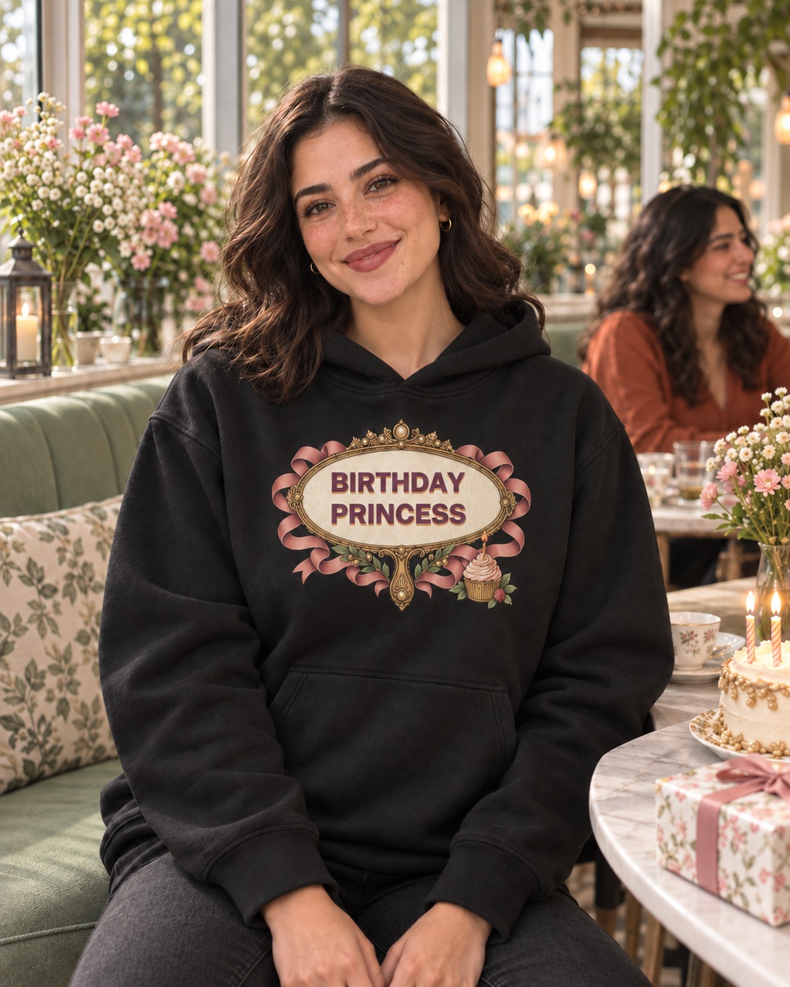 Black hoodie an ivory hand mirror with an engraved frame, pearl tiara, dusty rose ribbon and candle cupcake framing deep plum BIRTHDAY PRINCESS lettering with a warm solid shadow