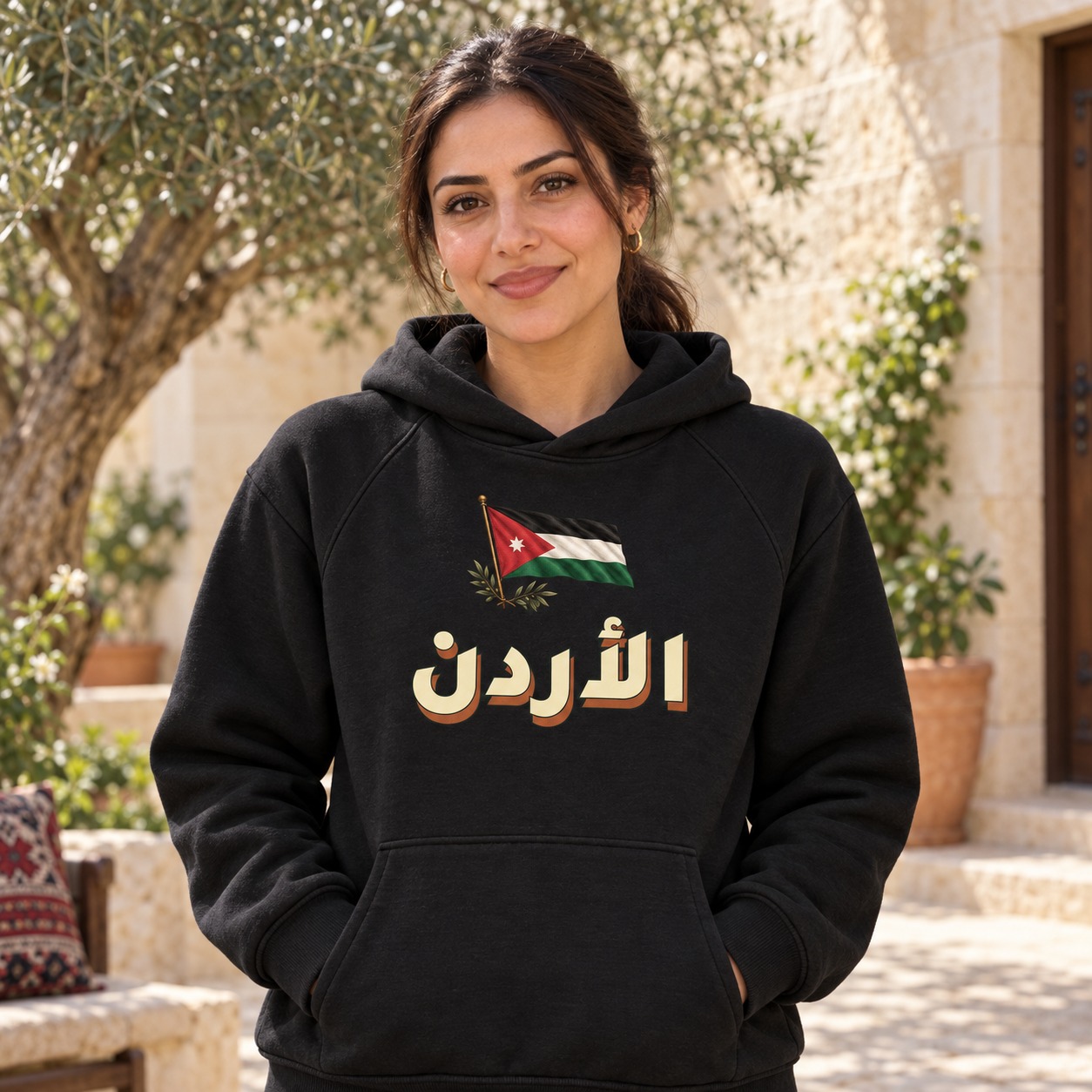 هودي أسود علم الأردن بنجمته السباعية وأغصان زيتون فوق اسم الأردن الكبير بالعاجي وظل صلب دافئ